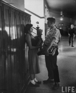 forties-fifties-sixties-love:  Students in the hallway of and Iowa high school, 1953 by Yale Joel  