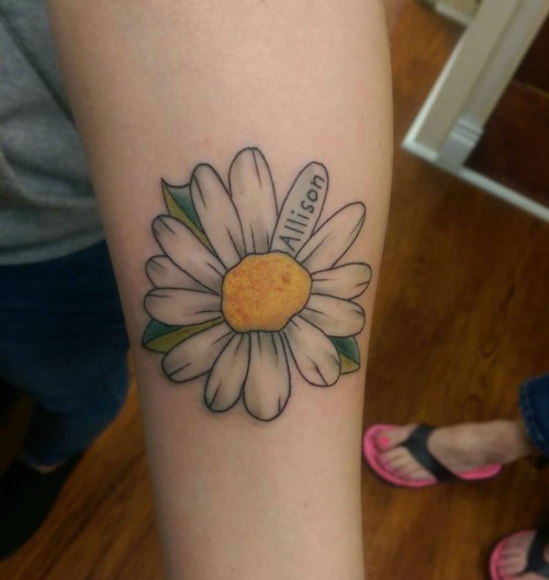 sortra:  24 Photos of Cheerful Daisy Tattoos  View Full Post
