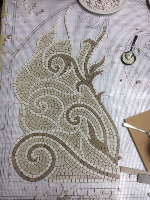 A new mosaic is born for a closed off fireplace space