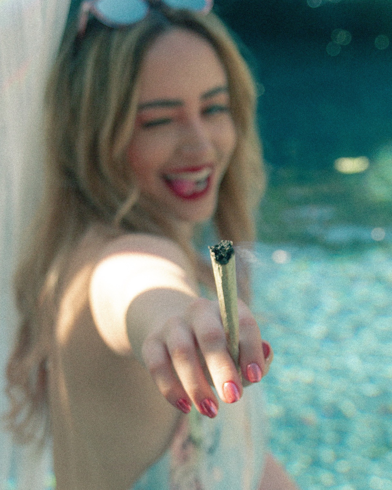 bakedlilbae:Nothing beats blunts at the pool in this 100° weather 💦📸: @rhyleephoto IG: