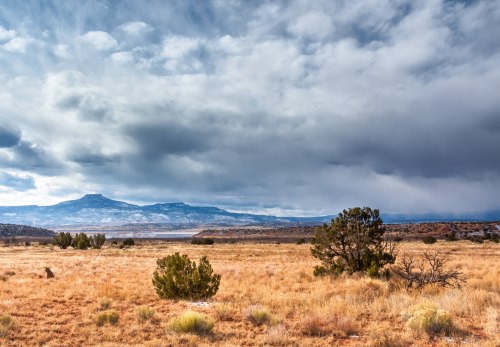 Clouds and rain roll in to the northern high plains of New Mexico over Lake Abiquiu.