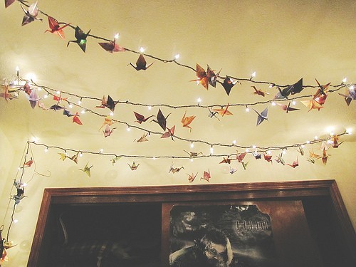 Paper cranes hung from fairy lights add a nice touch to an indie room!