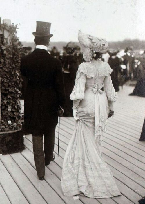 Fashion at the races in Longchamp, France. Photographed in 1900.