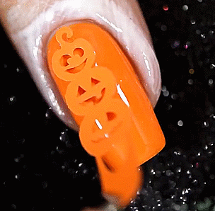 doorfus:sharkiestim:Pumpkin nails by sveta_sanders[Image description: Four gifs of someone applying 