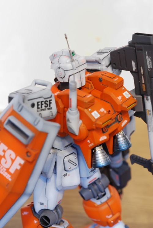 galaxyjunkyard:  hangmen13:  Powered GM custom built by clubmanKS Base Gunpla: HGUC 1/144 Powered GM  Another stunning Gundam custom, and we love the orange. 