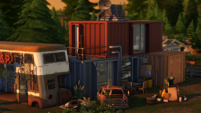 A container home in Moonwood Mill, a neighborhood in The Sims 4. There's an old trailer operating as a bar located next to it. There's a lot of garbage around.
