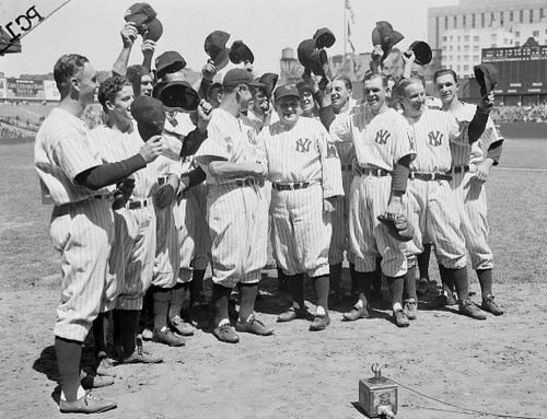 June 1, 1938: Manager Joe McCarthy, center, congratulates “The Iron Horse,  Lou Gehrig, before