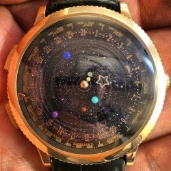 The Midnight Planétarium watch not only tells time, but follows the orbit of our solar system’s planets. 