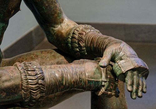 Seated Boxer (300–200 BC). Bronze and copper, 140 cm high. Museo Nazionale Romano—Palazzo Massimo al