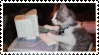 a stamp with a cat typing on a keyboard