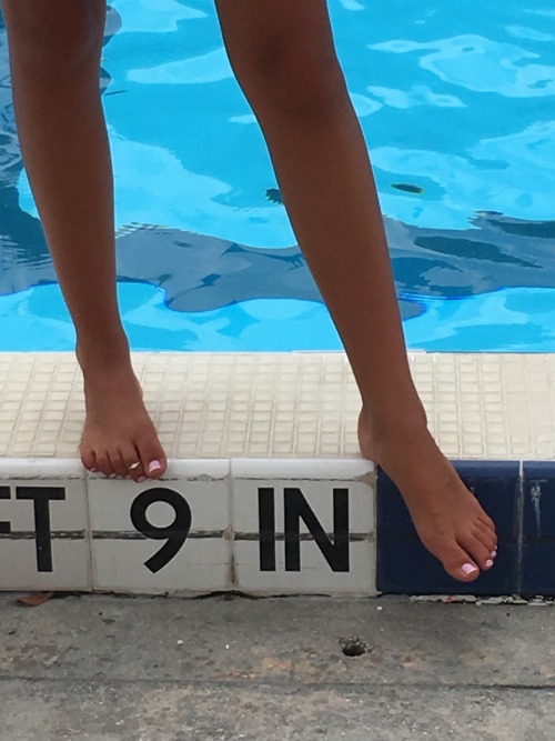 I took this pic today of a lifeguards sexy feet!! I kept staring at them thinking how suckable they 