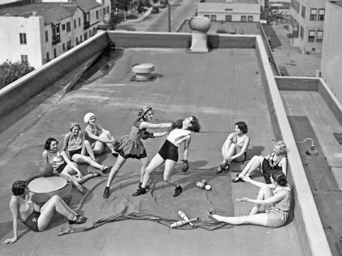 ivoryathena: Badass women from history Leather clad English rocker girl Women boxing on a roof in LA