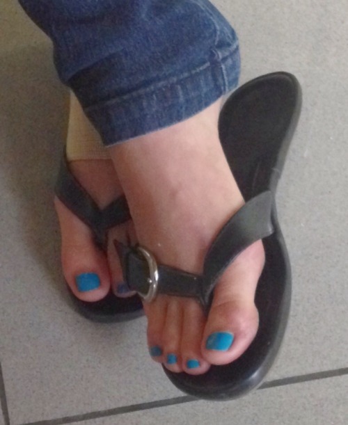Cool black thong sandals with a silver buckle.