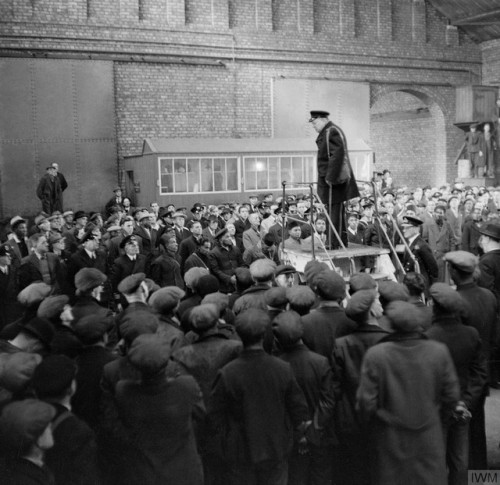 Winston Churchill gives a speech ina Liverpool warehouse to merchant ships’ crews and dockers,