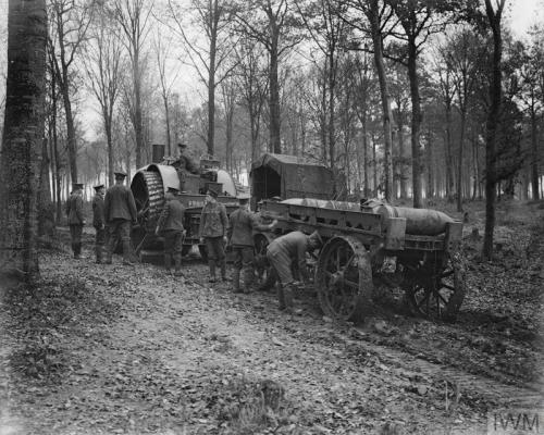 Royal Garrison Artillery at work by the tractor engine and trailer bringing shells up for the 15-ich