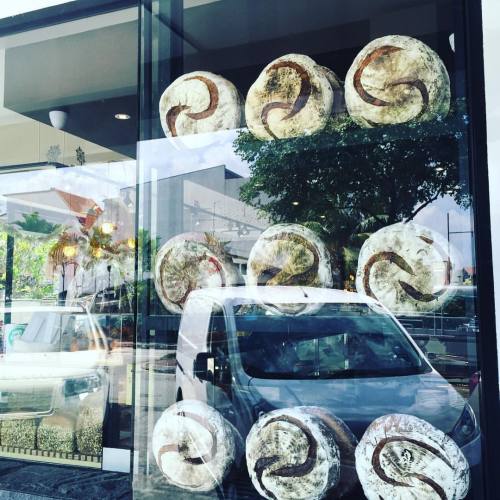 The wheels on the bus go round and round… Huge, farm-style loaves of sourdough bread stand te