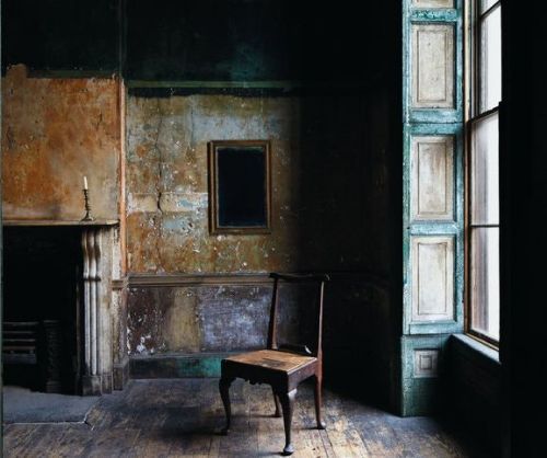 Layers of paint from over the past 200 years decorate the walls of an anteroom in a Georgian house a