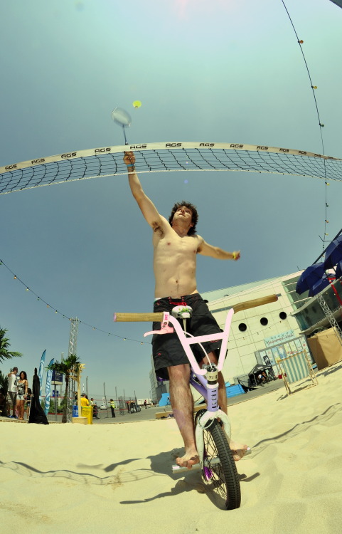 Álvaro Fernández riding at the Beach playing Badminton while doing some Flat BMX Action.