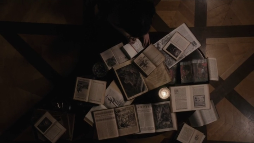 cinematic-literature:Penny Dreadful S03E07 (Ebb Tide)Picture 1: a book is illustrated with a winged 