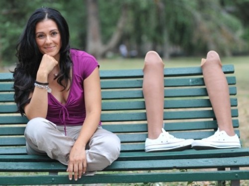 Photoset about Giusy Versace, her prosthetic legs, white converse sneakers