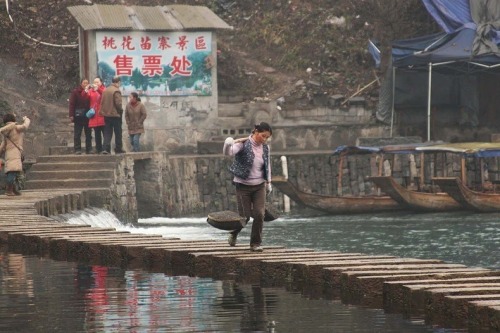 odditiesoflife:  The Ancient Town of Fenghuang, China The town of Fenghuang is located in the Hunan province in China along the banks of the Tuo Jiang River. The town is exceptionally well-preserved and relatively untouched by modern urbanization. The