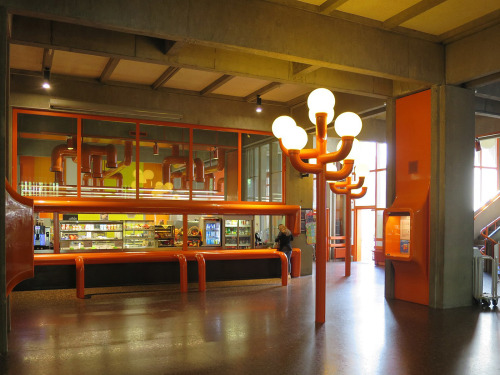 A dash of orange at specific architectural elements like lanterns and balustrades complements the do