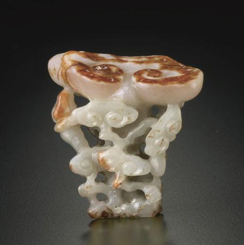 A celadon jade carving of a &lsquo;Lingzhi&rsquo; clusterQing Dynasty, 18th century, carved and pier