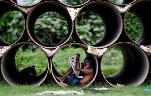 A man reads a newspaper in New Delhi, India on August 2, 2017. (Money Sharma/AFP/Getty Images)