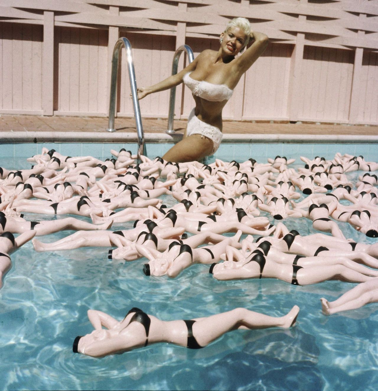 Jayne Mansfield posing in her pool with water bottles in her image, 1957. Photos by Allan Grant for LIFE magazine