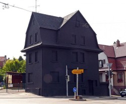 sixpenceee:  Haus in Schwarz (House in Black)  In the city centre of Möhringen, Germany, used to stand an unusual house that was painted completely black. It was a 2008 public art piece by artists Erik Sturm und Simon Jung. The piece was meant as a