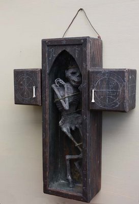 The Faustian cross The physical manifestation of a lesser daemon, bound in a wooden