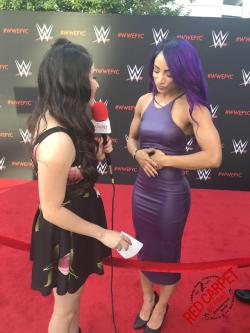 Sasha Banks in a tight purple dress