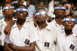 humanoidhistory:  Children watch the solar eclipse of March 29, 2006, in Accra, Ghana. (St. Louis Post-Dispatch) 