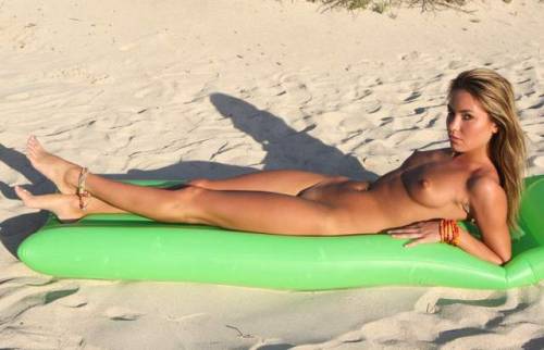 women-nudist:shaved blonde nudist sunbathing