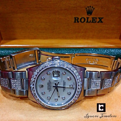 THIS IS A Men’s Rolex Date just Oyster Perpetual - Diamond WATCH!!! MOTHER OF PEARL DIAMOND DIAL & DIAMOND BEZEL Scratch Resistant Glare proof Sapphire Crystal Steel Case & DIAMOND Bracelet. Contact Loucri Jewelers for this and other Luxury Time...