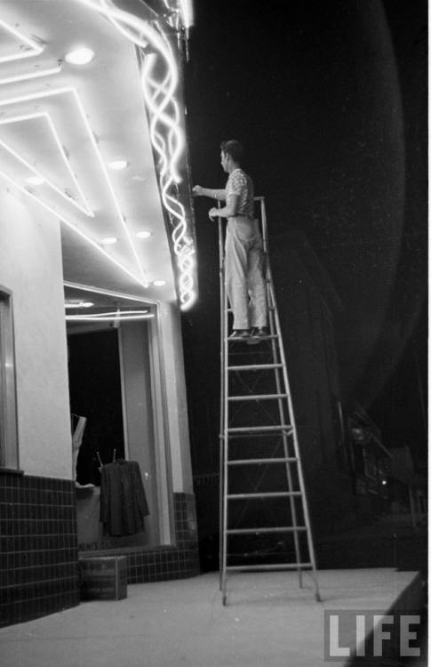 Updating the movie marquee(Joseph Scherschel or George Silk. 1950)