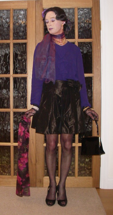 Purple chiffon blouse and satin mini-skirt. The skirt has a pretty bow on the waist. I love my chiff