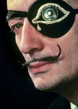vintagegal:  Salvador Dali, with his own creation of a diamond eyepatch, photographed by Philippe Halsman, 1947 (via)