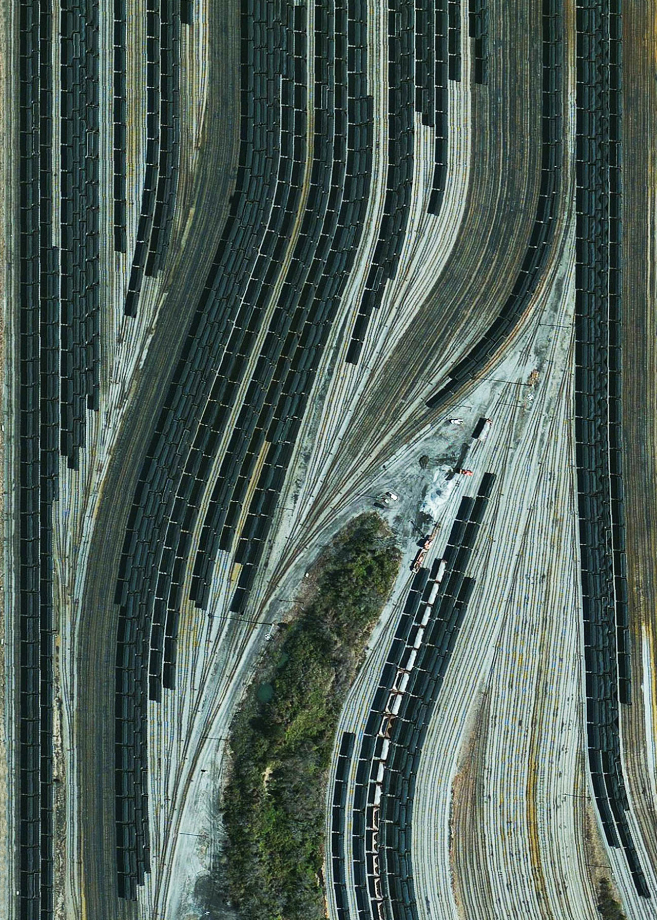 dailyoverview:  Train cars filled with coal are stationed in Norfolk, Virginia. Operated