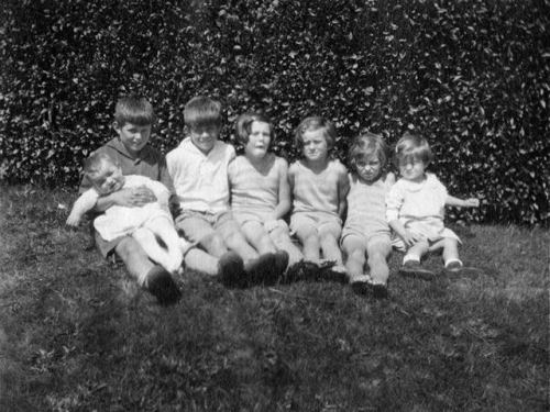 Joe. Jr holding Robert, John, Rosemary, Kathleen, Eunice, and Patricia. The two youngest, Jean and E