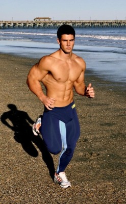 boarddog73:  Muscle hunk running on the beach in tights 