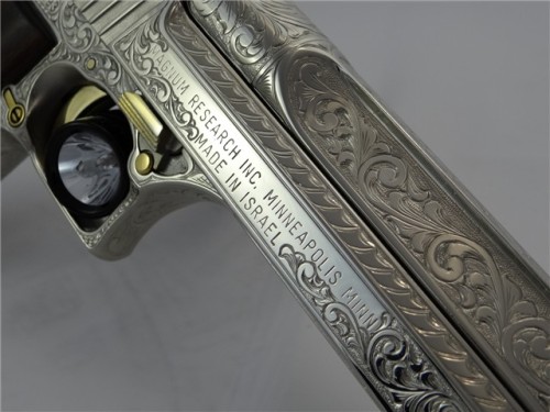 cavalier-renegade:  gunrunnerhell:  Desert Eagle Custom engraved Desert Eagle in .44 Magnum, it is accented with 24K gold on several parts throughout the gun. The engraver, Santiago Leis, is one of the most famous engravers in the gun community. It’s