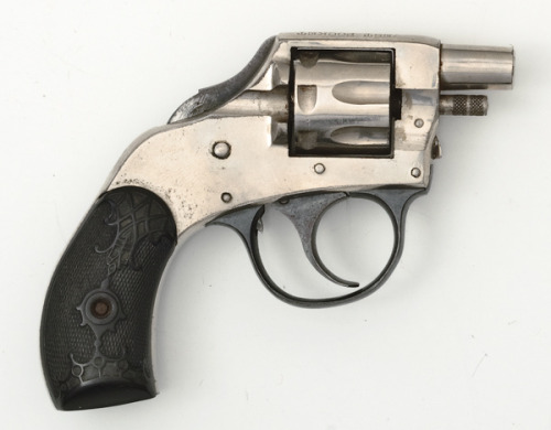 An H&R hammerless vest revolver with 1 inch barrel and no sights.