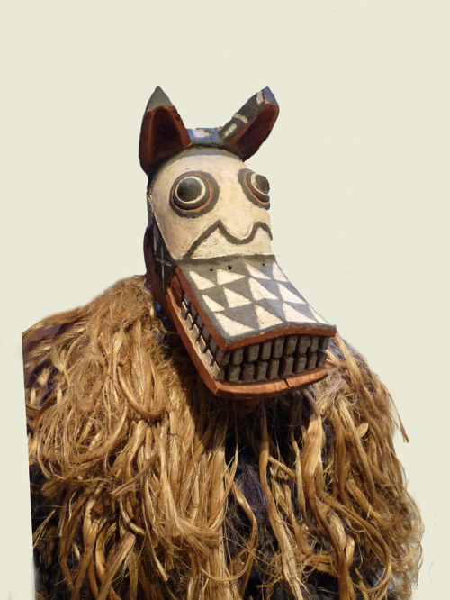 Hyena mask of the Bwa people, Burkina Faso, made from painted wood and vegetable fibers.  Now in the