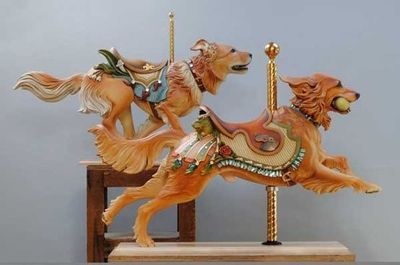 bochelly:  OH MY GOD THIS ARTIST. HE IS AMAZING. DOGS AND CAROUSELS. HE MAKES CUSTOM CARVED DOGS. 