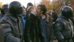 paintdeath:  Gay rights activists kiss as they are detained by police officers during a gay rights protest in St. Petersburg