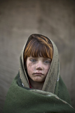 visitafghanistan: January 24, 2014 photo, Afghan refugee girl, laiba Hazrat, 6, poses for a  picture, while playing with other children in a slum on the outskirts  of Islamabad, Pakistan. (Photo by Muhammed Muheisen/AP Photo) 