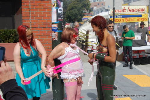 mistressaliceinbondageland:  Folsom Street Fair sissy handjob on the corner of 8th St and Folsom…  This is the most public cumshot I have ever filmed and one of the most extreme public humiliation movies in my collection. I love this shoot so much.