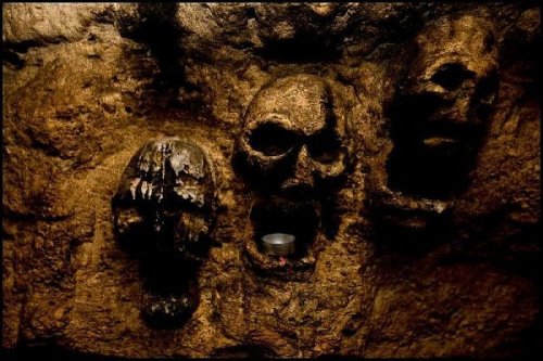Paris Catacombs By the light of torches, candles or miners lights, haunting scenes centuries old app