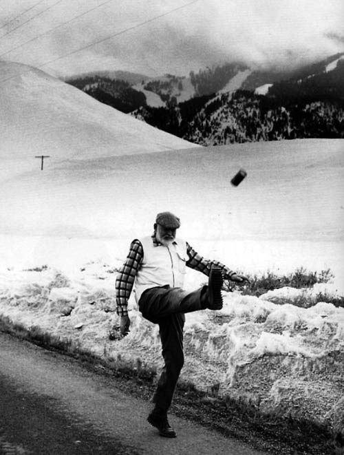 Ernest Hemingway kicking a beer can a year before he died. Idaho, 1960.